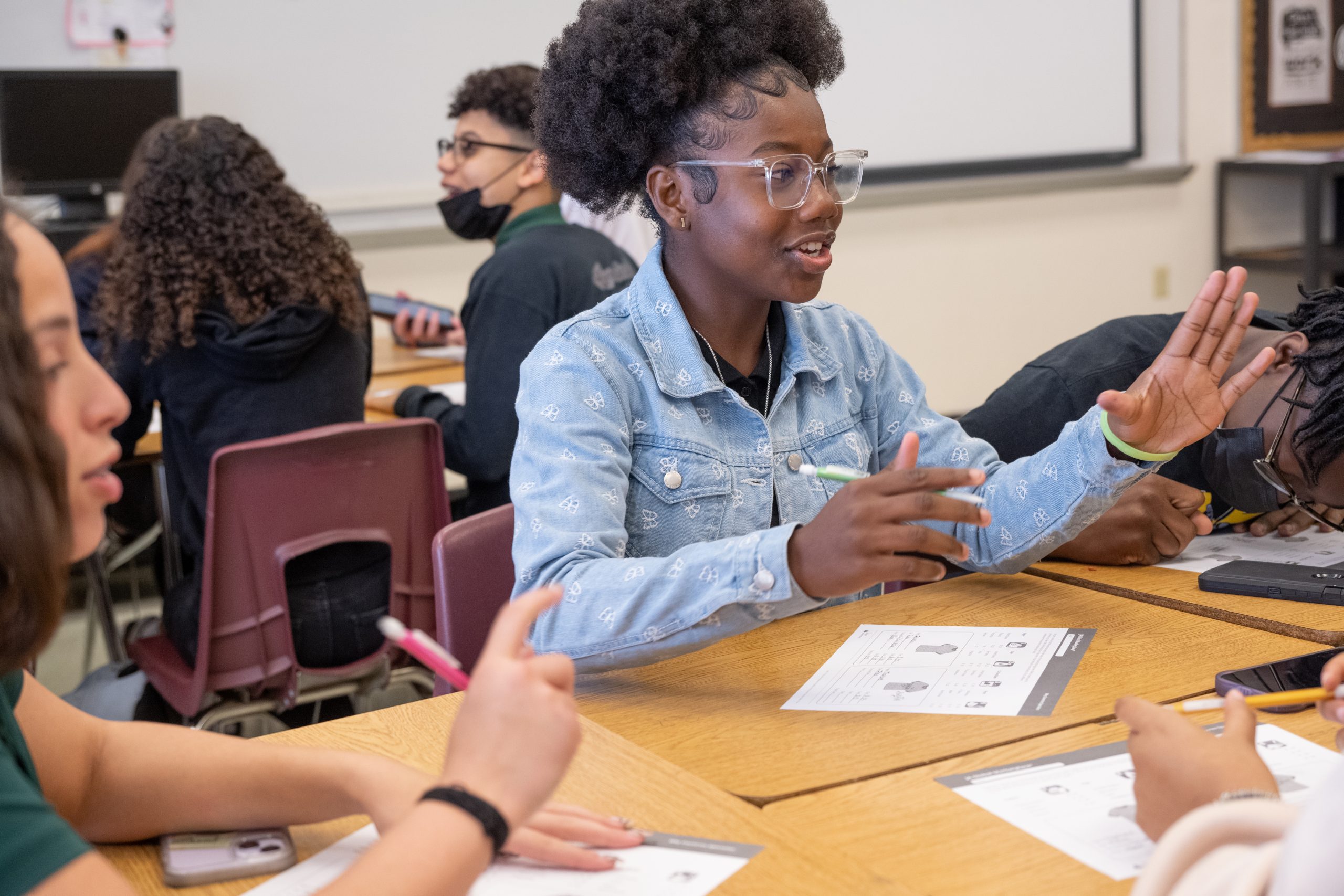 Middle School Student Talking to a Group